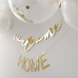 Комплект за украса с надпис „Welcome Home“ и балони в бяло, златно и конфети, дължина 4 м, подходящ за посрещане на новородено или любим човек, Emotions Factory.